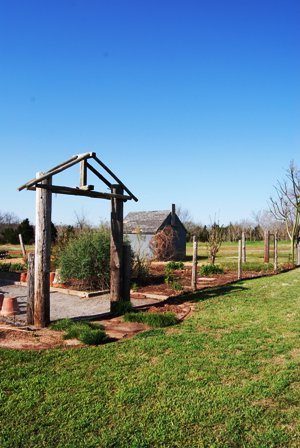 Arbor gracing the front of the display gardens