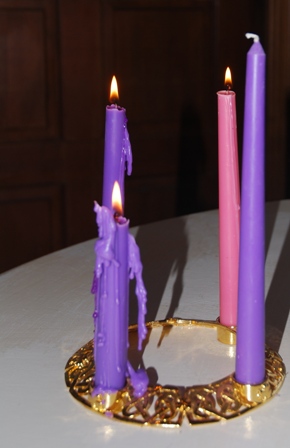 Advent wreath with three weeks lit.  This Sunday is the final one of Advent and only a few days before Christmas.