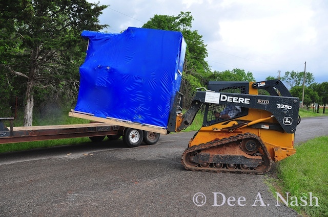 Bill unloading the greenhouse from the truck. It was touch and go.