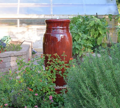 Side of the greenhouse and red fountain. I'm toying with the idea of keeping it up and running this year.